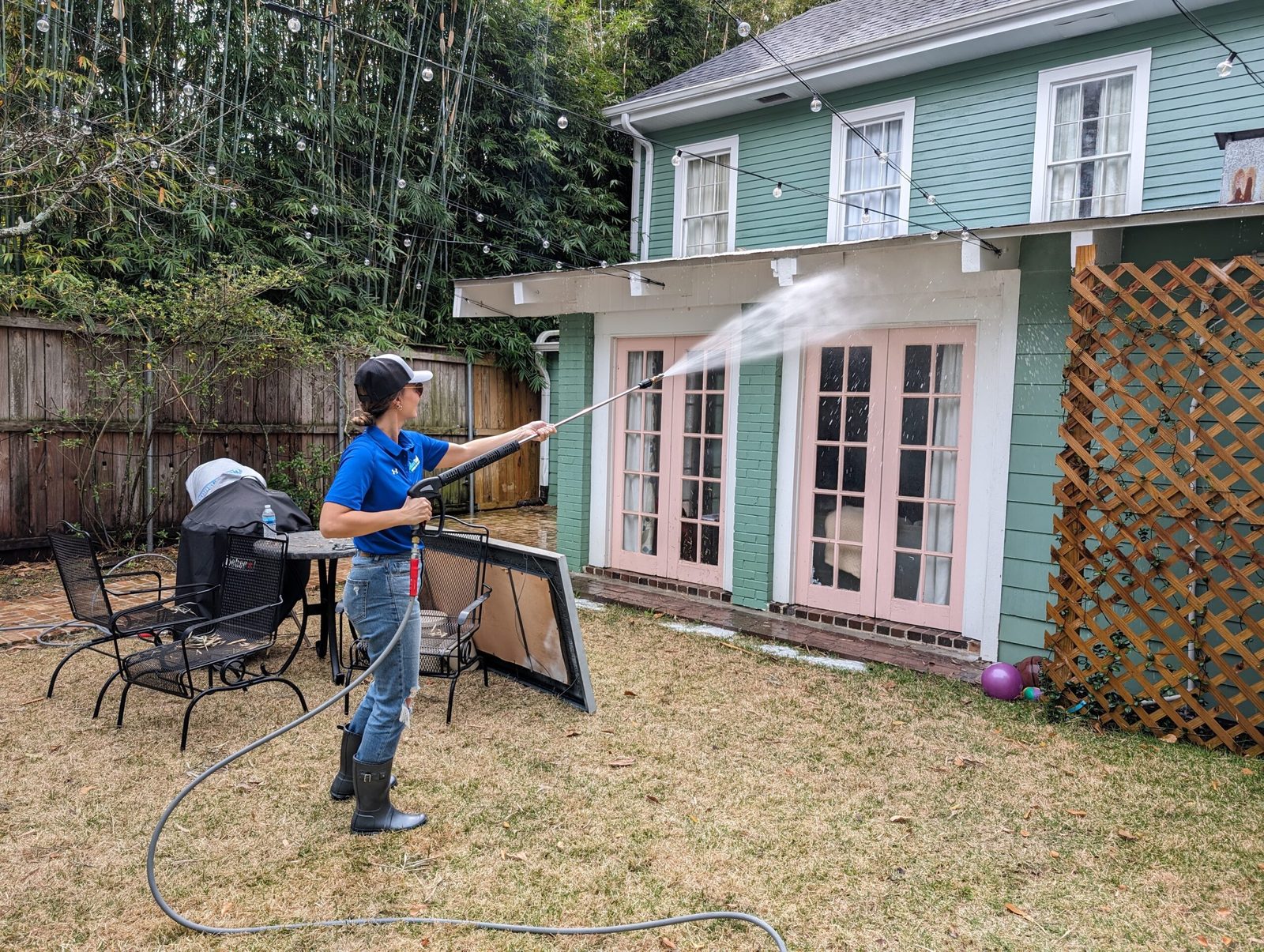 Rolling Suds tech soft washing a home exterior